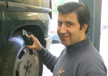 A mechanic working on a car