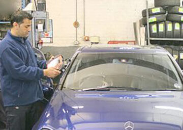 A mechanic working on a car